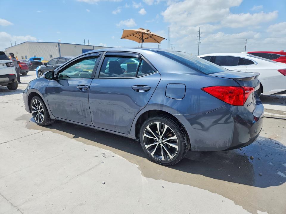 2018 Toyota Corolla VIN 5YFBURHE5JP816565 COPART salvage auction — WATER/FLOOD, TX - SALVAGE TITLE-FLOOD DAMAGE, sold $1,800 on 2026-07-24 (photo 2)