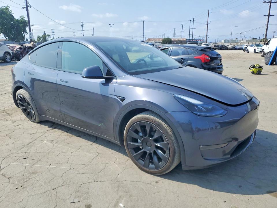 2023 Tesla Model y VIN 7SAYGDEE4PA047845 COPART salvage auction — REAR END, CA - SALVAGE CERTIFICATE, sold $8,400 on 2026-07-30 (photo 4)