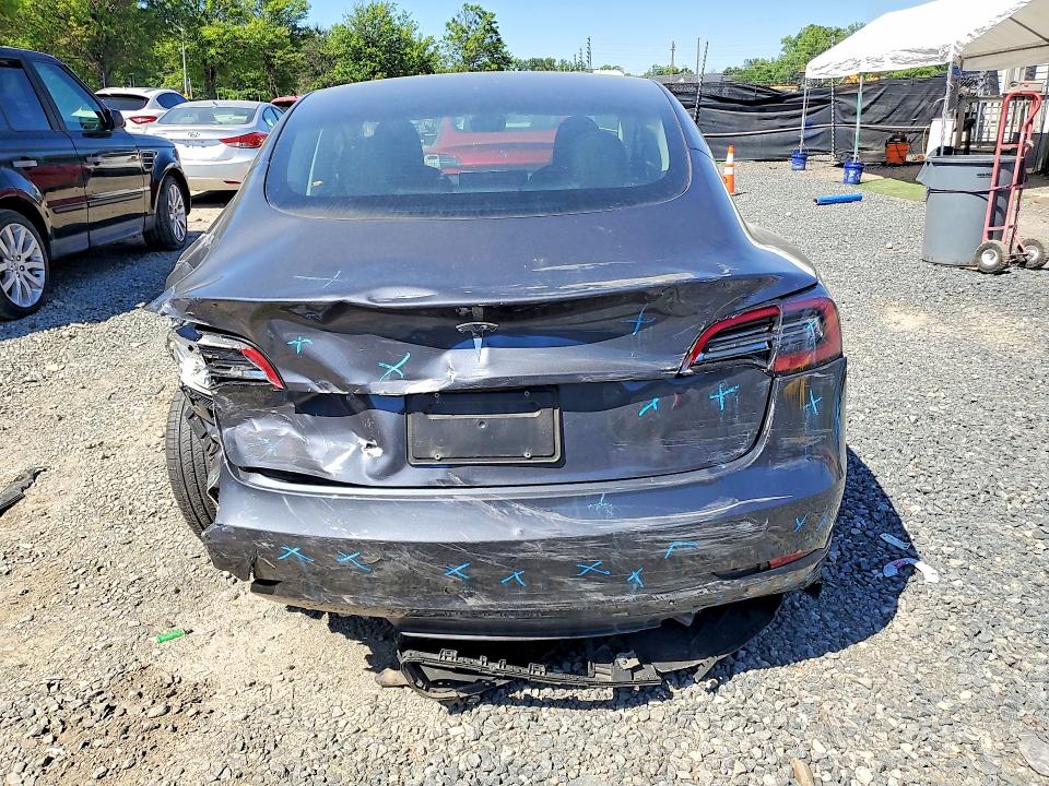 2023 Tesla Model 3 VIN 5YJ3E1EA6PF610258 COPART salvage auction — REAR END, Salvage Title, sold $5,400 on 2026-07-09 (photo 6)