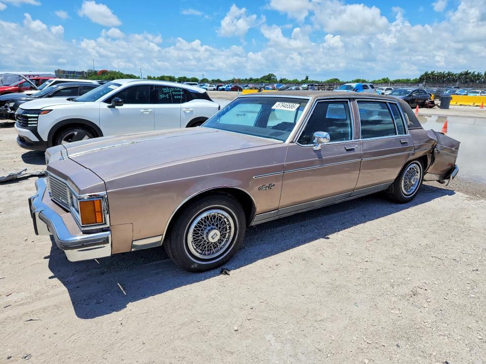 1984 Oldsmobile 98 VIN 1G3AG69Y6EM871948 COPART salvage auction — REAR END, Fl - Cert Of Ttl-Rebuilt&Slvg Rbld, sold $275 on 2026-07-29 (photo 1)