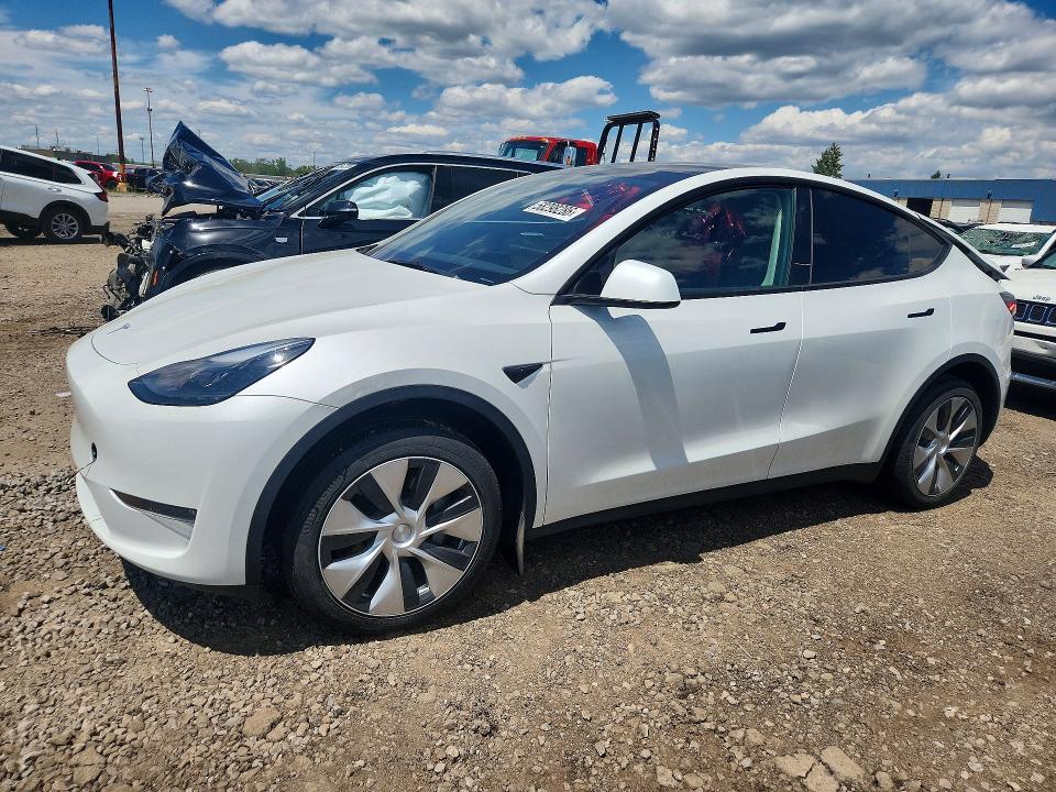 2023 Tesla Model y VIN 7SAYGDEEXPF671829 COPART salvage auction — REAR END, MI - CERTIFICATE OF TITLE, sold $15,600 on 2026-07-10 (photo 1)