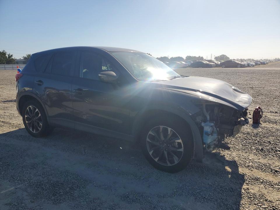2016 Mazda VIN JM3KE4DY4G0792219 COPART salvage auction — FRONT END, Ca - Salvage Certificate, sold $2,500 on 2026-07-14 (photo 4)