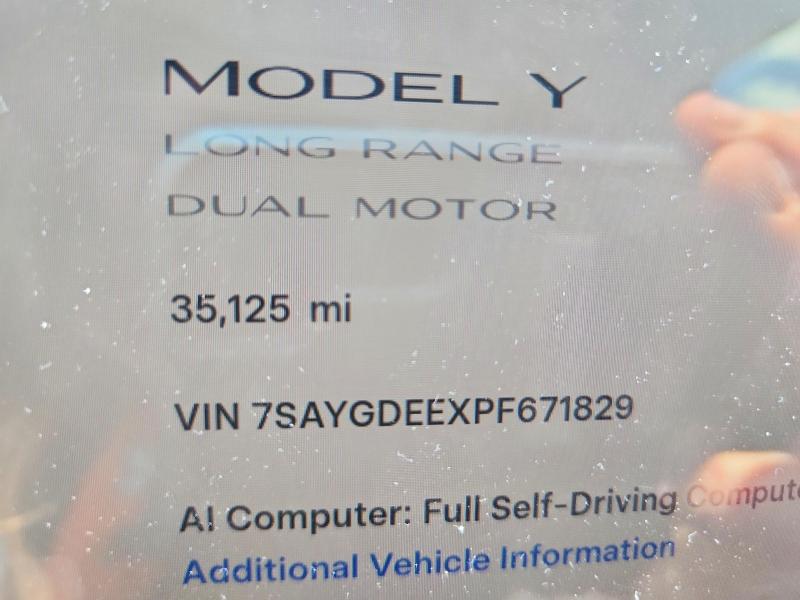 2023 Tesla Model y VIN 7SAYGDEEXPF671829 COPART salvage auction — REAR END, MI - CERTIFICATE OF TITLE, sold $15,600 on 2026-07-10 (photo 9)