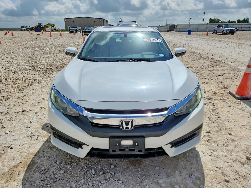 2016 Honda VIN 19XFC2F7XGE002115 COPART salvage auction — SIDE, Tx - Salvage Vehicle Title, sold $90 on 2026-07-09 (photo 5)