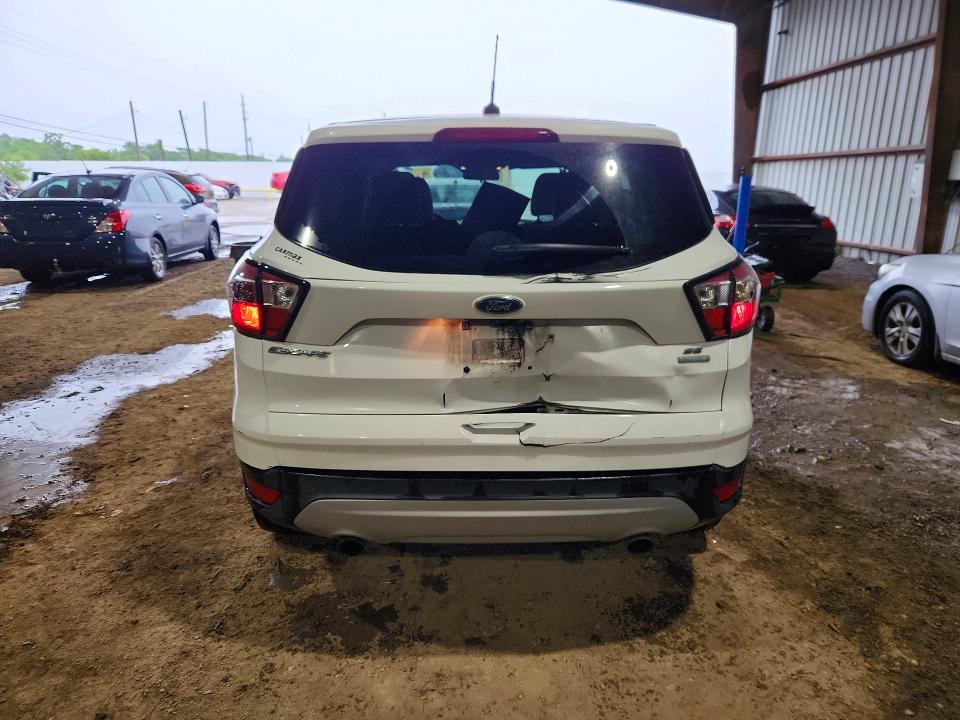 2017 Ford Escape VIN 1FMCU0GD5HUB42662 COPART salvage auction — SIDE, Tx - Salvage Vehicle Title, sold $1,750 on 2026-07-02 (photo 6)