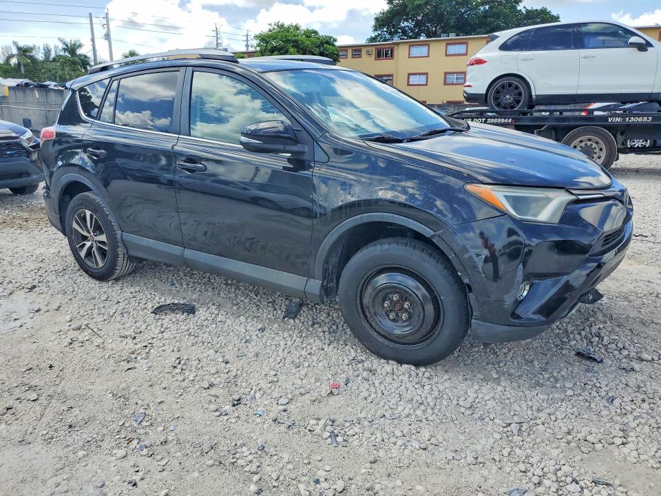 2017 Toyota Rav 4 VIN 2T3WFREV8HW369472 COPART salvage auction — SIDE, Fl - Cert Of Title Slvg Rebuildable, sold $6,400 on 2026-07-02 (photo 4)