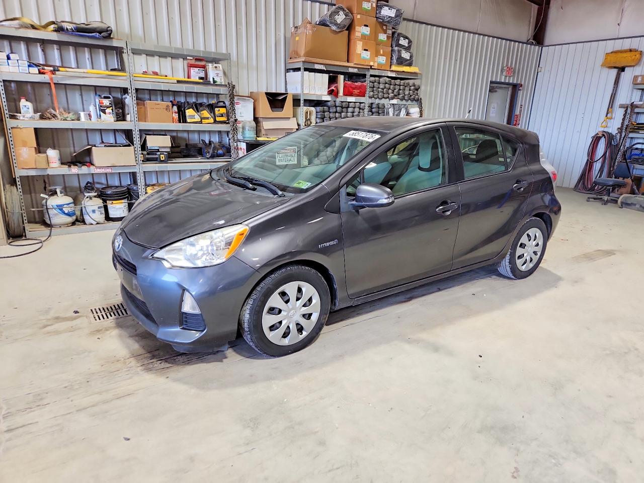 2014 Toyota Prius C VIN JTDKDTB30E1067916 — COPART salvage auction photo