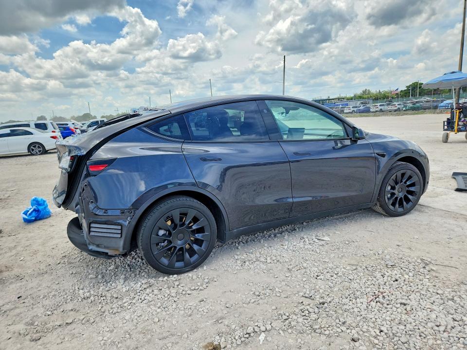 2024 Tesla Model y VIN 7SAYGDEDXRF050990 COPART salvage auction — REAR END, Fl - Cert Of Title Slvg Rebuildable, sold $8,600 on 2026-07-09 (photo 3)