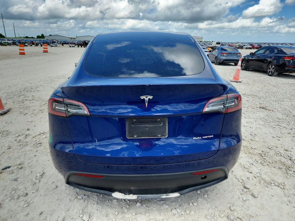 2024 Tesla Model y VIN 7SAYGAEEXRF115490 COPART salvage auction — SIDE, TX - SALVAGE VEHICLE TITLE (P), sold $13,700 on 2026-07-16 (photo 6)