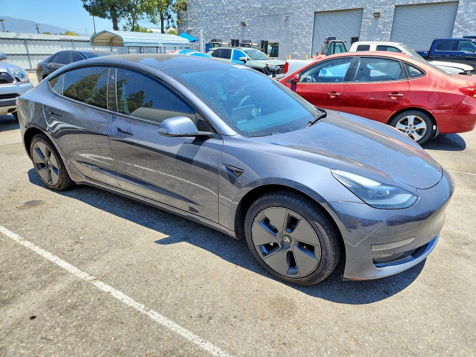 2023 Tesla Model 3 VIN 5YJ3E1EA8PF692056 COPART salvage auction — REAR END, Ca - Salvage Certificate, sold $7,700 on 2026-07-16 (photo 4)
