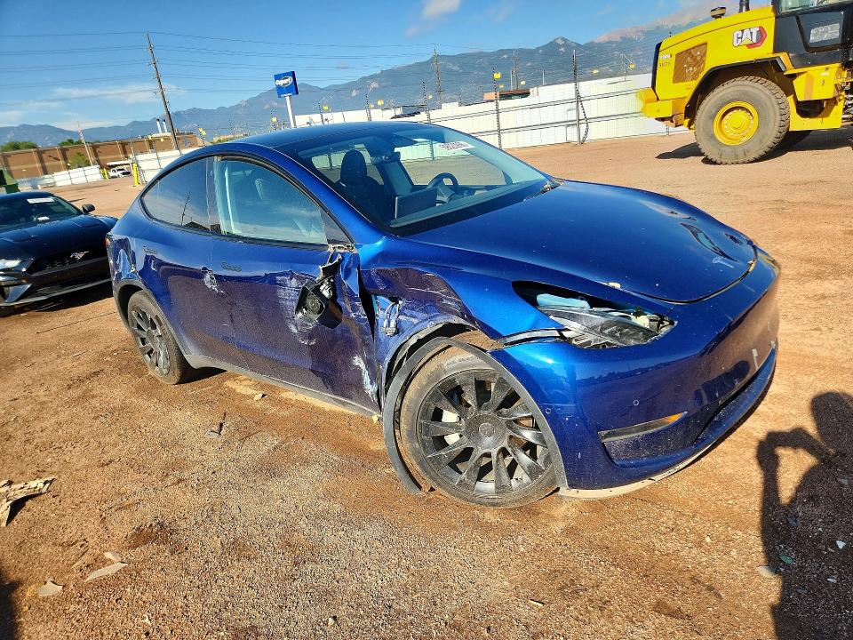 2022 Tesla Model y VIN 7SAYGDEE3NA011075 COPART salvage auction — ALL OVER, CO - SALVAGE TITLE, sold $6,600 on 2026-08-21 (photo 4)