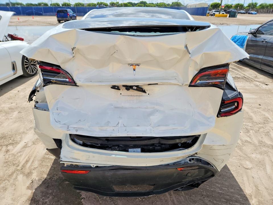 2024 Tesla Model y VIN 7SAYGDED0RF041831 COPART salvage auction — REAR END, Fl - Cert Of Title Slvg Rebuildable, sold $7,700 on 2026-07-15 (photo 6)