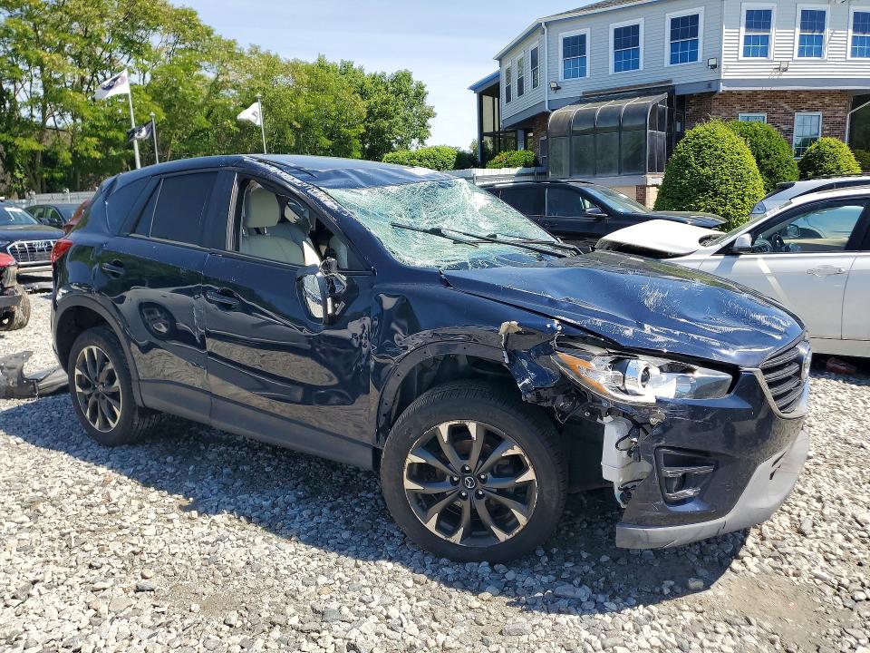 2016 Mazda VIN JM3KE4DY1G0767228 COPART salvage auction — ROLLOVER, Ma - Cert Of Title-Reconstrctd Coll, sold $2,350 on 2026-07-16 (photo 4)