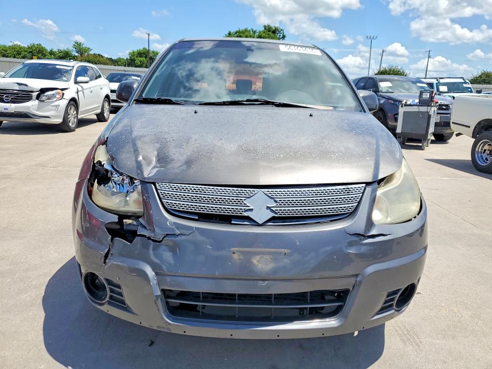 2012 Suzuki VIN JS2YC5A33C6304060 COPART salvage auction — FRONT END, TX - SALVAGE VEHICLE TITLE (P), sold $175 on 2026-07-16 (photo 5)