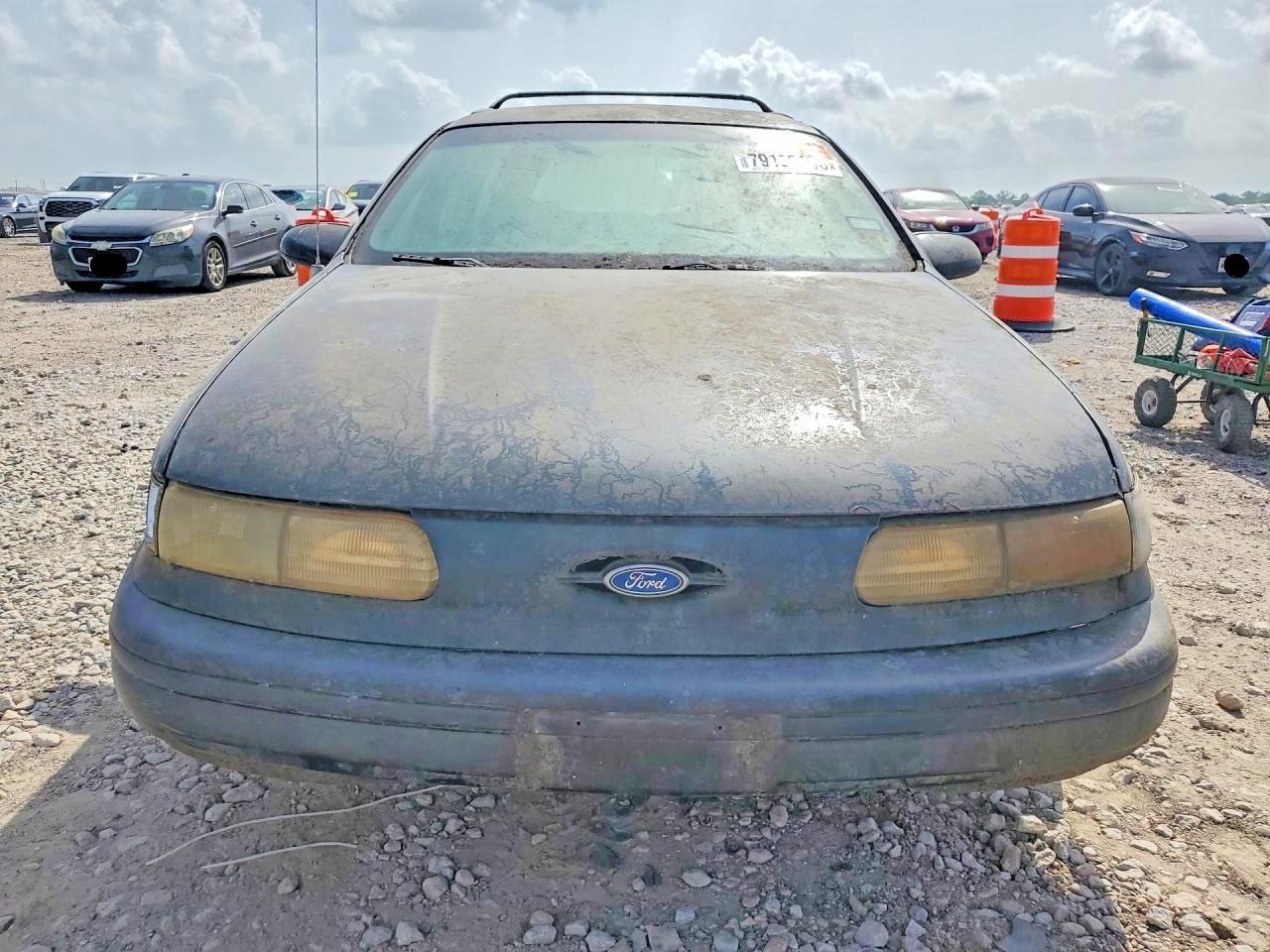 1994 Ford Taurus VIN 1FALP57UXRA217745 COPART salvage auction — Rear End, TX - CERTIFICATE OF TITLE, sold $150 on 2026-07-02 (photo 5)