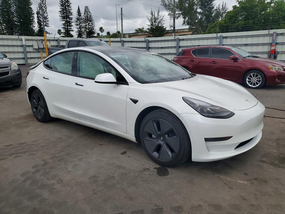 2021 Tesla Model 3 VIN 5YJ3E1EA7MF973146 COPART salvage auction — REAR END, Fl - Cert Of Title Slvg Rebuildable, sold $7,900 on 2026-07-15 (photo 4)