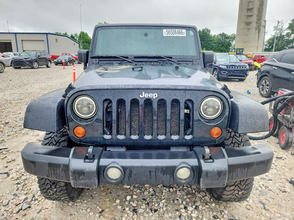 2009 Jeep Wrangler unlimited VIN 1J4GA59129L751093 COPART salvage auction — ENGINE BURN, Mi - Certificate Of Title, sold $725 on 2026-07-09 (photo 5)