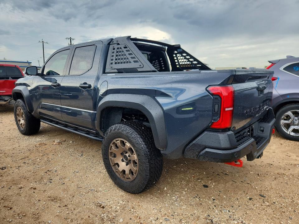 2025 Toyota Tacoma VIN 3TYLC5LN6ST043657 COPART salvage auction — SIDE, Tx - Salvage Vehicle Title, sold $50,000 on 2026-07-30 (photo 2)