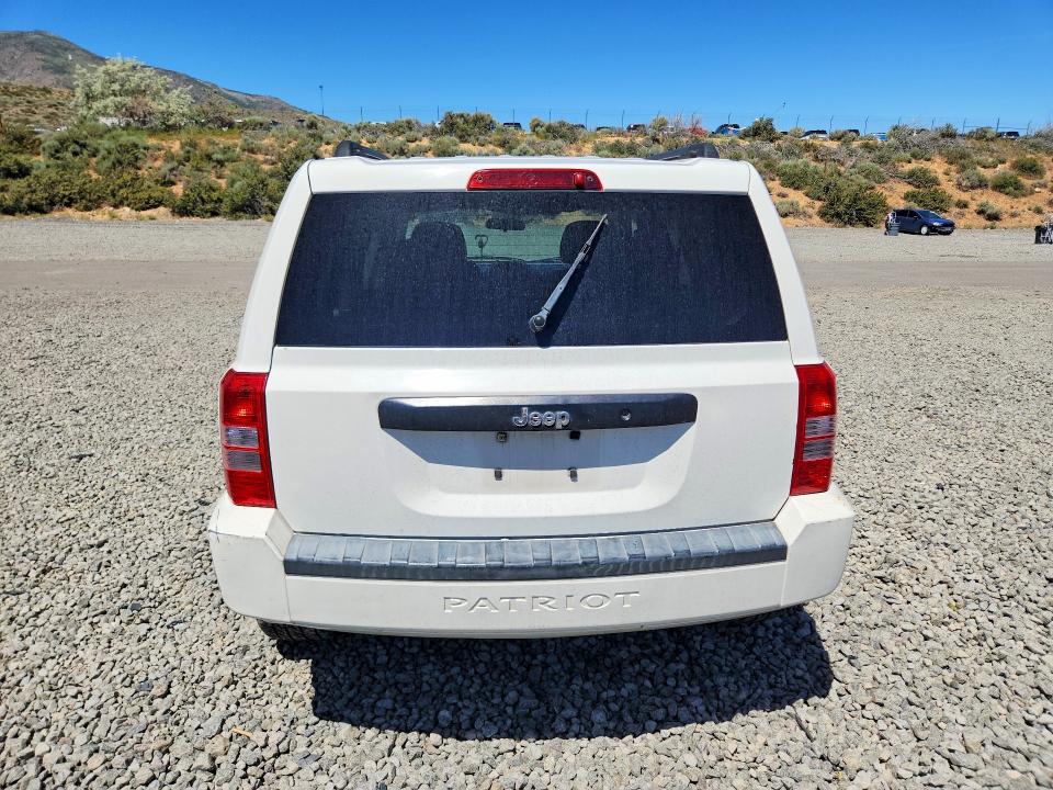 2010 Jeep Liberty (patriot) VIN 1J4NT1GA9AD624675 COPART salvage auction — SIDE, Nv - Salvage Title, sold $500 on 2026-08-20 (photo 6)
