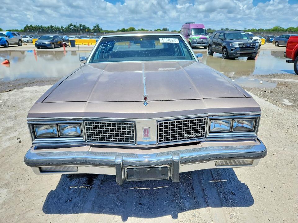 1984 Oldsmobile 98 VIN 1G3AG69Y6EM871948 COPART salvage auction — REAR END, Fl - Cert Of Ttl-Rebuilt&Slvg Rbld, sold $275 on 2026-07-29 (photo 5)
