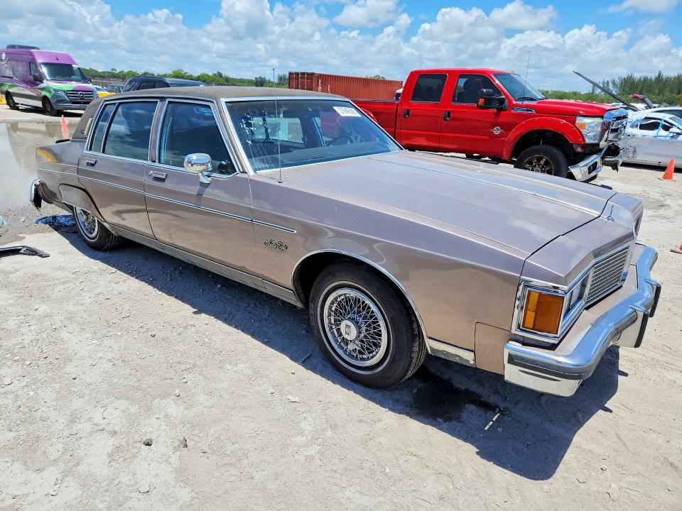 1984 Oldsmobile 98 VIN 1G3AG69Y6EM871948 COPART salvage auction — REAR END, Fl - Cert Of Ttl-Rebuilt&Slvg Rbld, sold $275 on 2026-07-29 (photo 4)