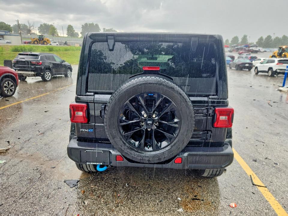 2023 Jeep Wrangler / VIN 1C4JJXP65PW557062 COPART salvage auction — MINOR DENT/SCRATCHES, MO - CERTIFICATE OF TITLE, sold $21,000 on 2026-07-09 (photo 6)
