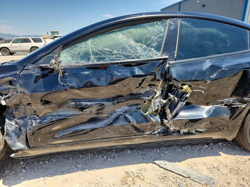 2022 Tesla Model 3 VIN 5YJ3E1EB4NF192305 COPART salvage auction — SIDE, UT - SALVAGE CERTIFICATE, sold $1,650 on 2026-09-04 (photo 7)
