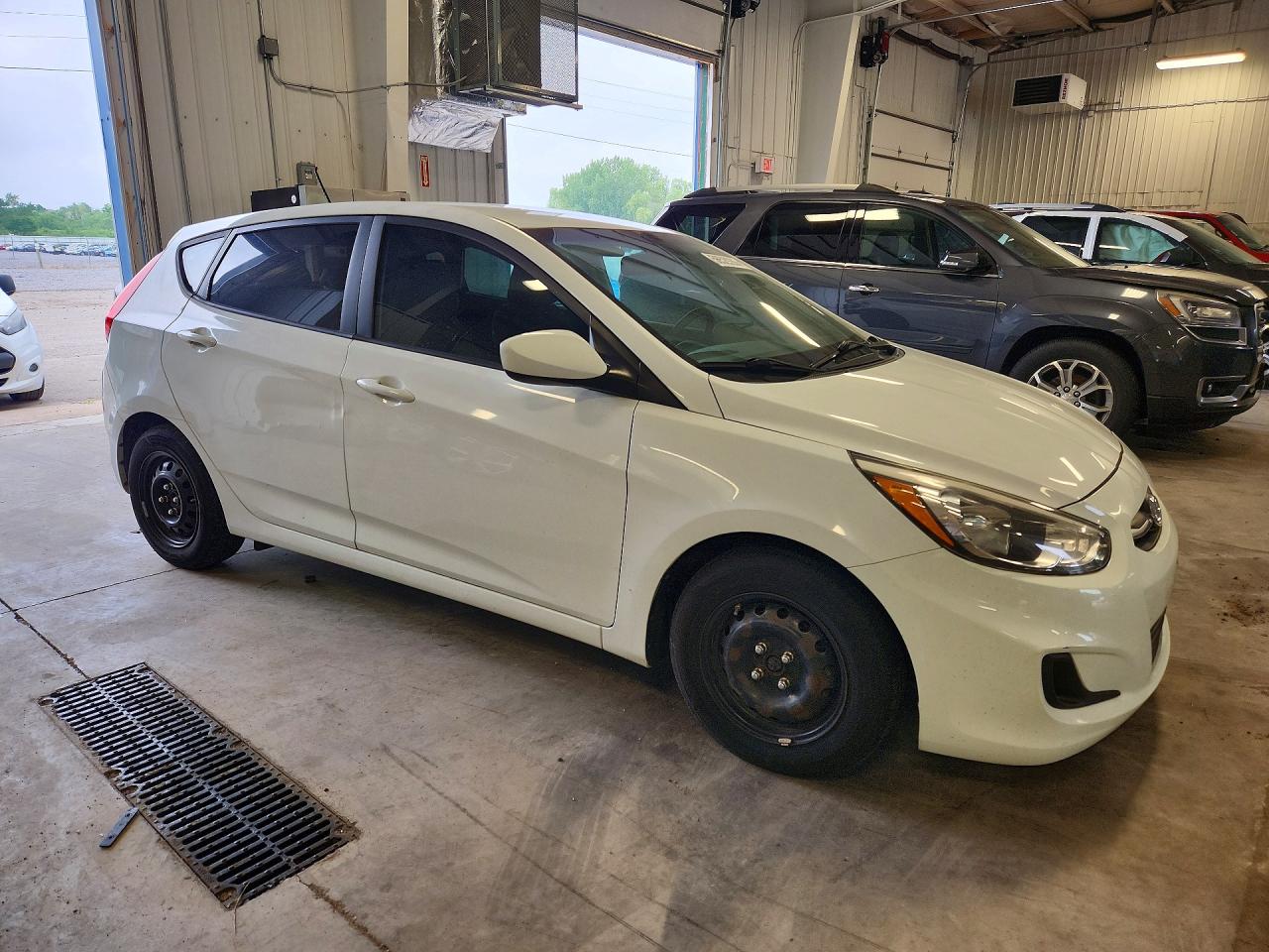 2016 Hyundai Accent VIN KMHCT5AEXGU241350 COPART salvage auction — Rear End, MN - CERT OF TITLE-PR SALV FLOOD, sold $725 on 2026-07-07 (photo 4)
