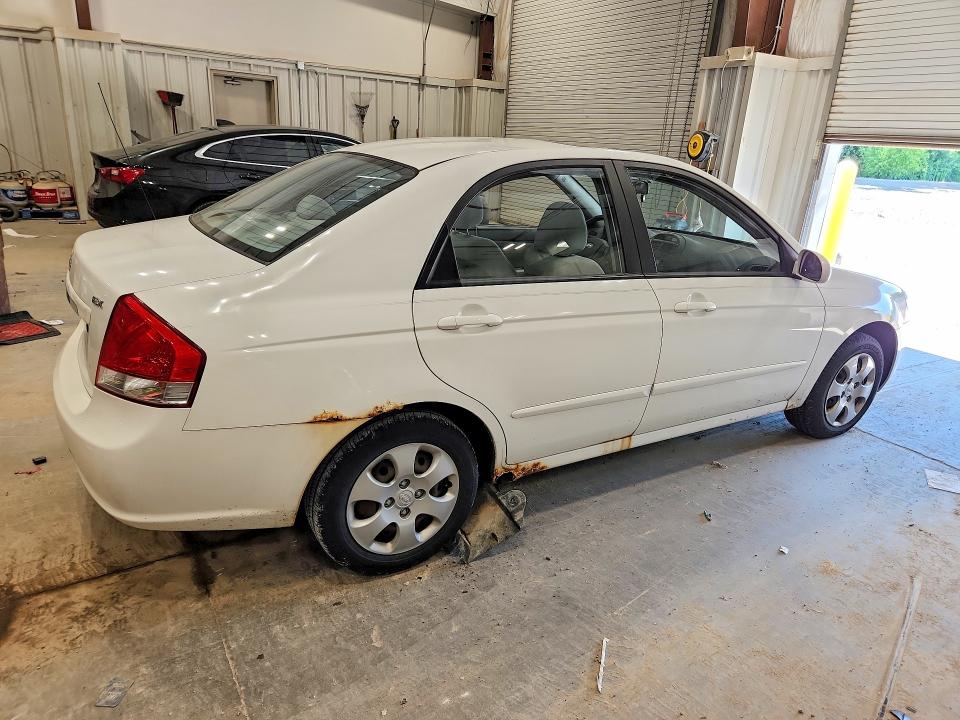 2009 Kia Spectra VIN KNAFE221795613517 COPART salvage auction — HAIL, Wi - Certificate Of Title, sold $275 on 2026-07-08 (photo 3)