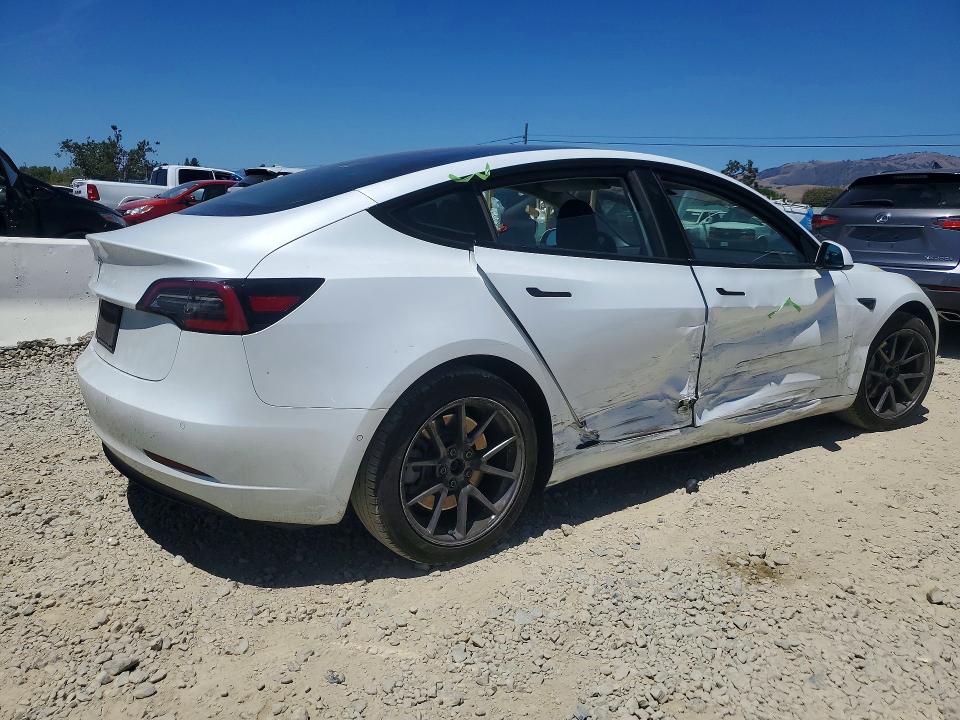 2021 Tesla Model 3 VIN 5YJ3E1EA9MF876949 COPART salvage auction — SIDE, CA - SALVAGE CERTIFICATE, sold $7,800 on 2026-07-16 (photo 3)