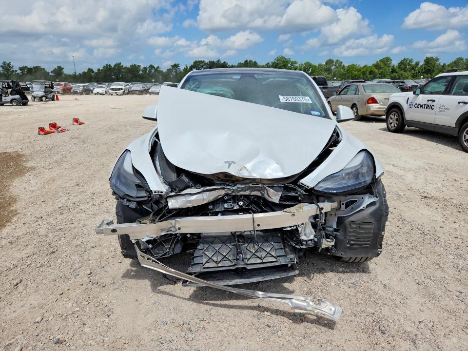 2022 Tesla Model y VIN 7SAYGAEE1NF549808 COPART salvage auction — FRONT END, TX - SALVAGE VEHICLE TITLE, sold $150 on 2026-07-28 (photo 5)
