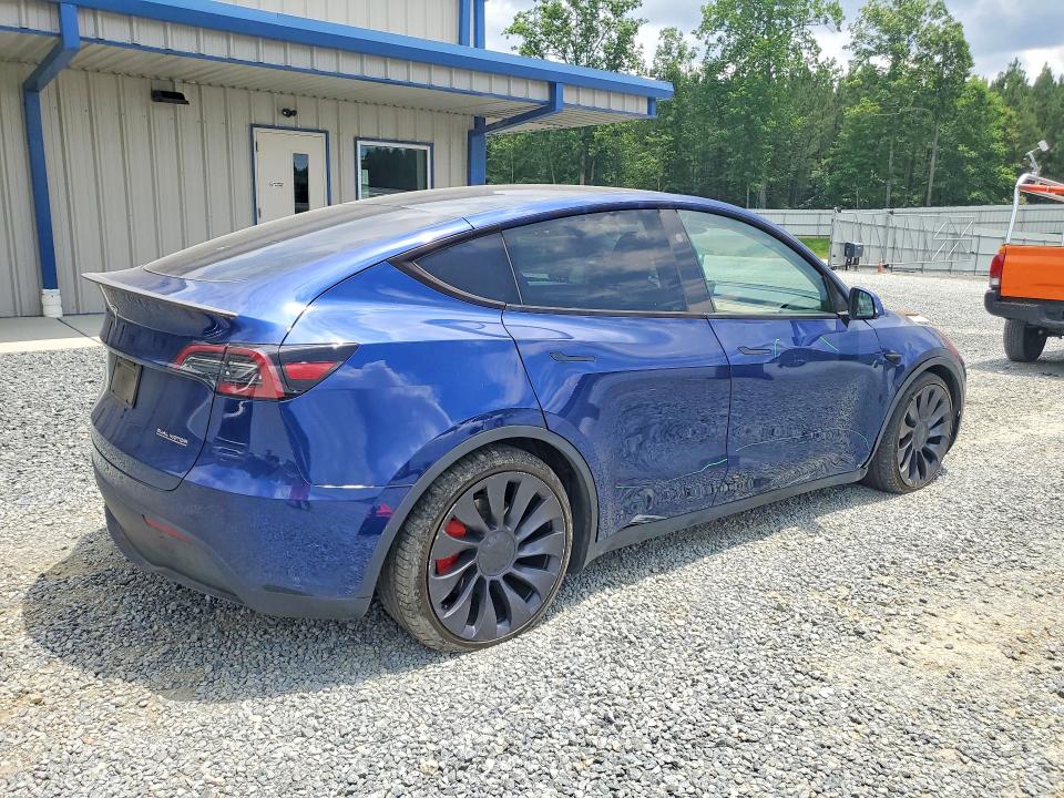 2024 Tesla Model y VIN 7SAYGDEF2RA265200 COPART salvage auction — SIDE, Nc - Salvage Certificate Of Title, sold $13,300 on 2026-07-23 (photo 3)