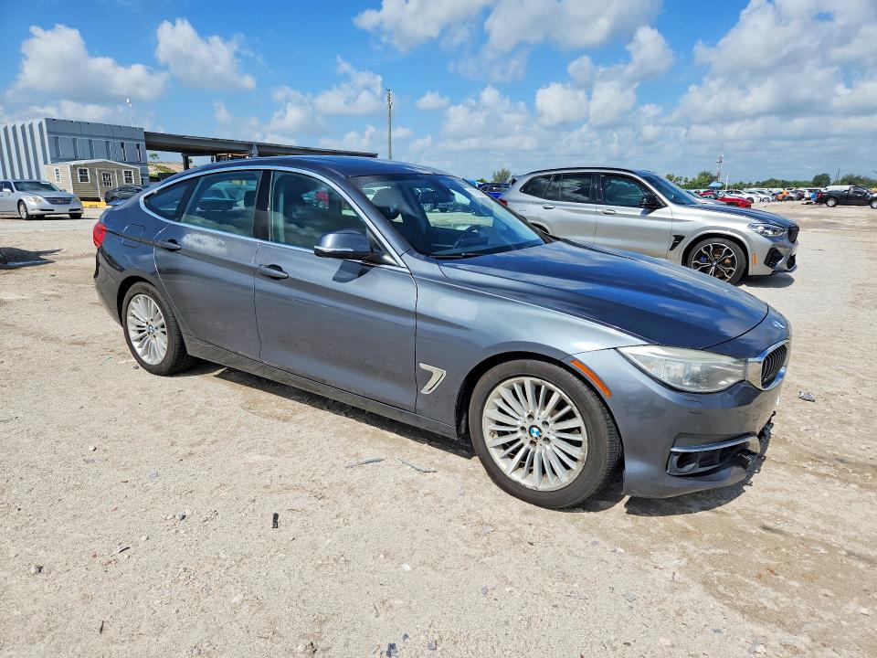 2015 BMW 3er VIN WBA3X5C55FD562777 COPART salvage auction — MINOR DENT/SCRATCHES, FL - CERTIFICATE OF TITLE, sold $2,500 on 2026-07-28 (photo 4)