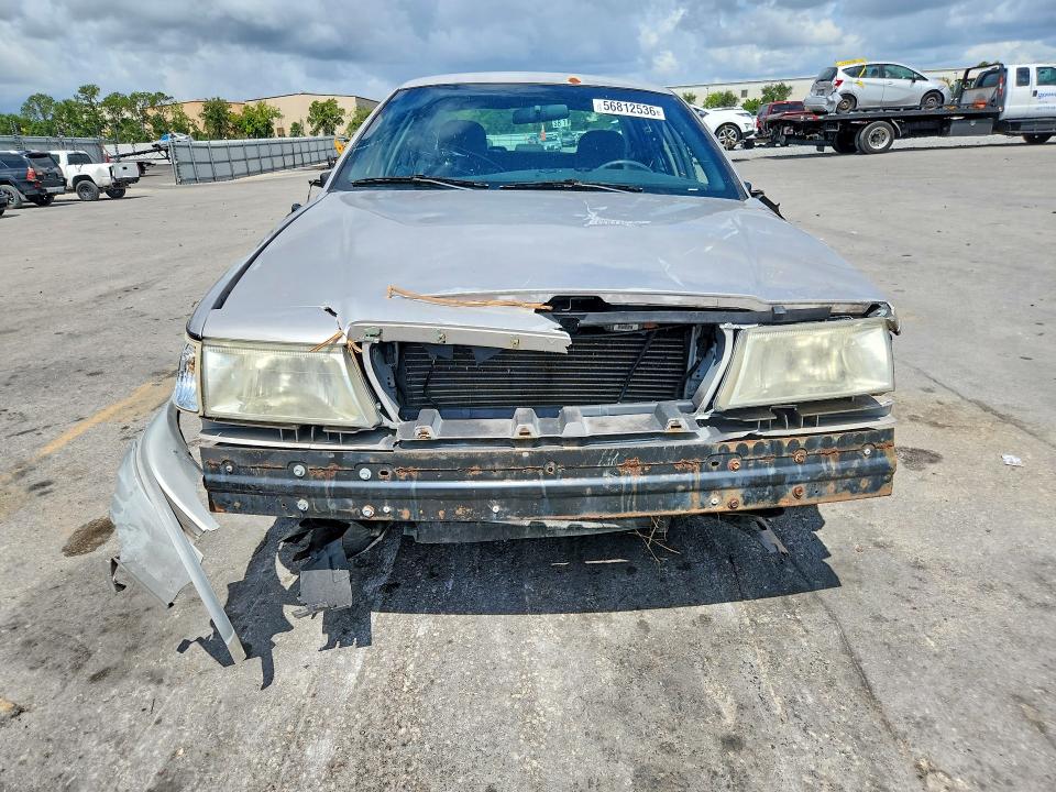 2004 Mercury Grand marquis VIN 2MEFM74W74X668924 COPART salvage auction — FRONT END, FL - CERT OF TITLE SLVG REBUILDABLE, sold $15 on 2026-07-21 (photo 5)