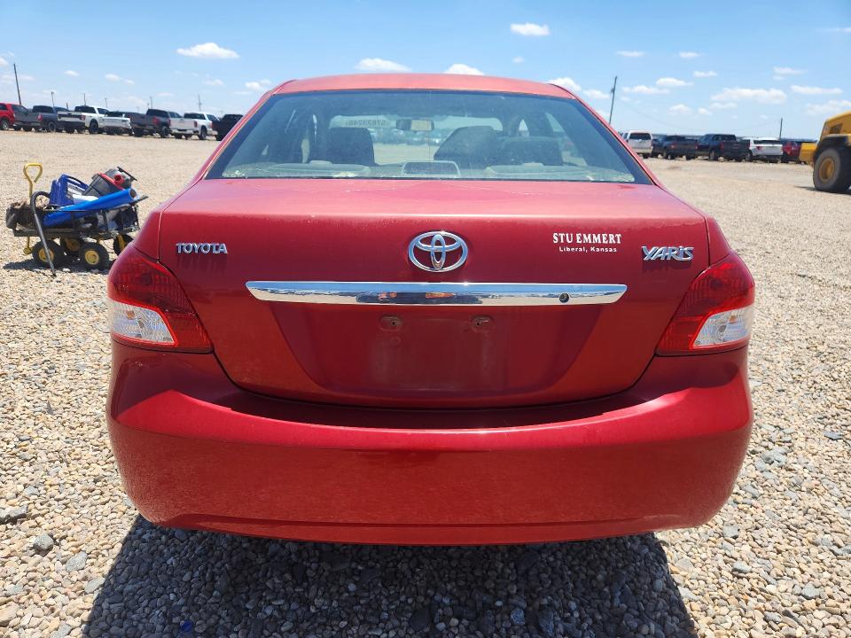 2011 Toyota Yaris VIN JTDBT4K30B1404802 COPART salvage auction — SIDE, Ks - Cert Of Title-Salvage, sold $750 on 2026-07-28 (photo 6)