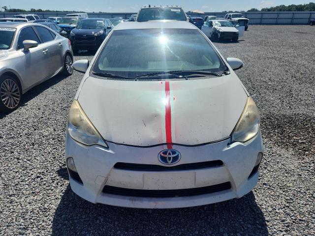 2014 Toyota Prius c VIN JTDKDTB3XE1572717 COPART salvage auction — MINOR DENT/SCRATCHES, Fl - Certificate Of Title, sold $1,050 on 2026-07-07 (photo 5)