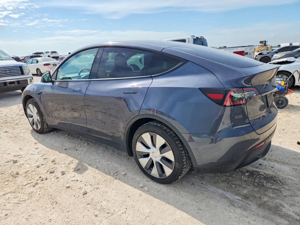 2023 Tesla VIN 7SAYGDED5PF958132 COPART salvage auction — SIDE, Tx - Salvage Vehicle Title, sold $2,000 on 2026-07-30 (photo 2)
