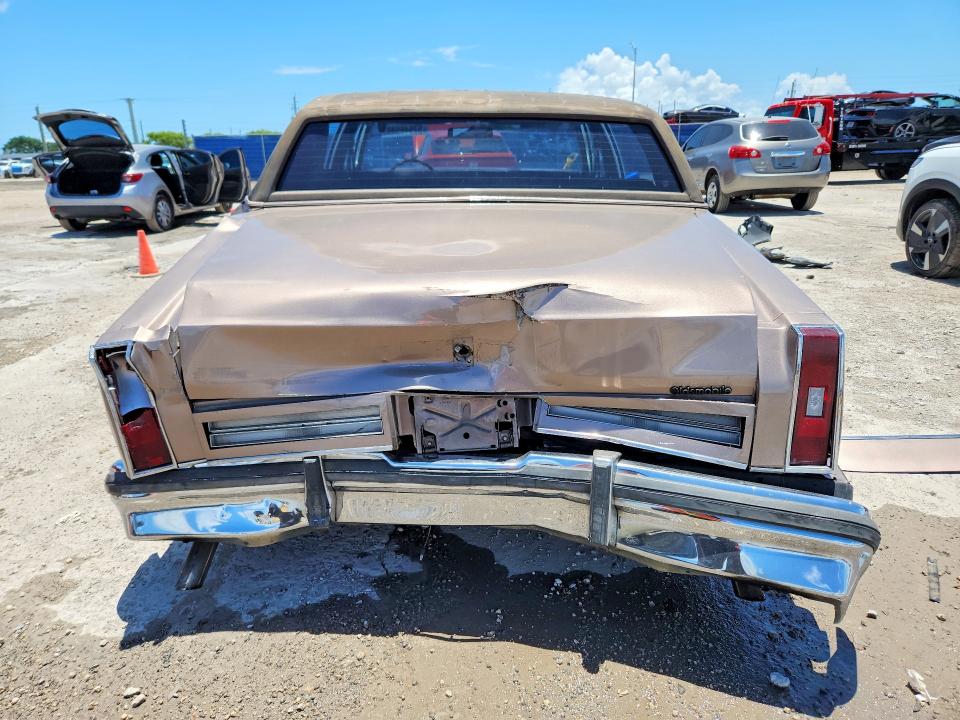 1984 Oldsmobile 98 VIN 1G3AG69Y6EM871948 COPART salvage auction — REAR END, Fl - Cert Of Ttl-Rebuilt&Slvg Rbld, sold $275 on 2026-07-29 (photo 6)