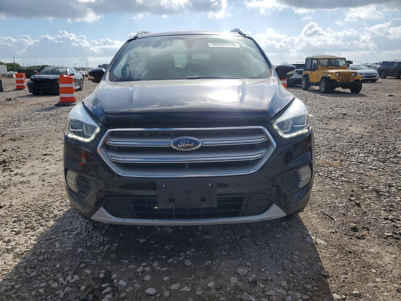 2017 Ford Escape VIN 1FMCU0J98HUD84298 COPART salvage auction — Side, TX - SALVAGE VEHICLE TITLE, sold $2,300 on 2026-07-02 (photo 5)