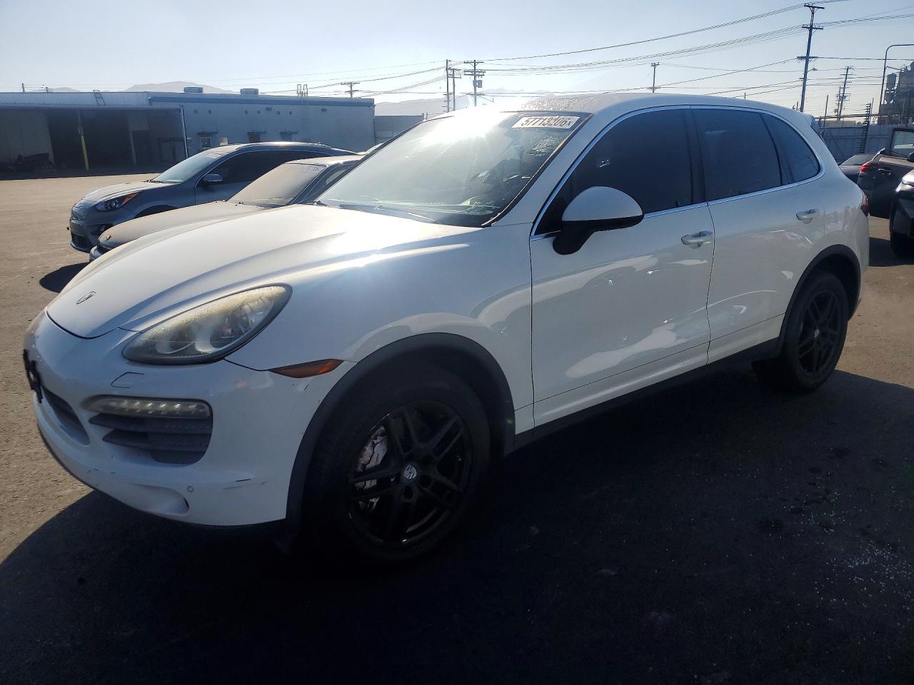 2011 Porsche Cayenne VIN WP1AB2A25BLA42058 COPART salvage auction — Side, FL - DIS/DLR/EXP ONLY CLEAN TITLE, sold $1,150 on 2026-07-08 (photo 1)