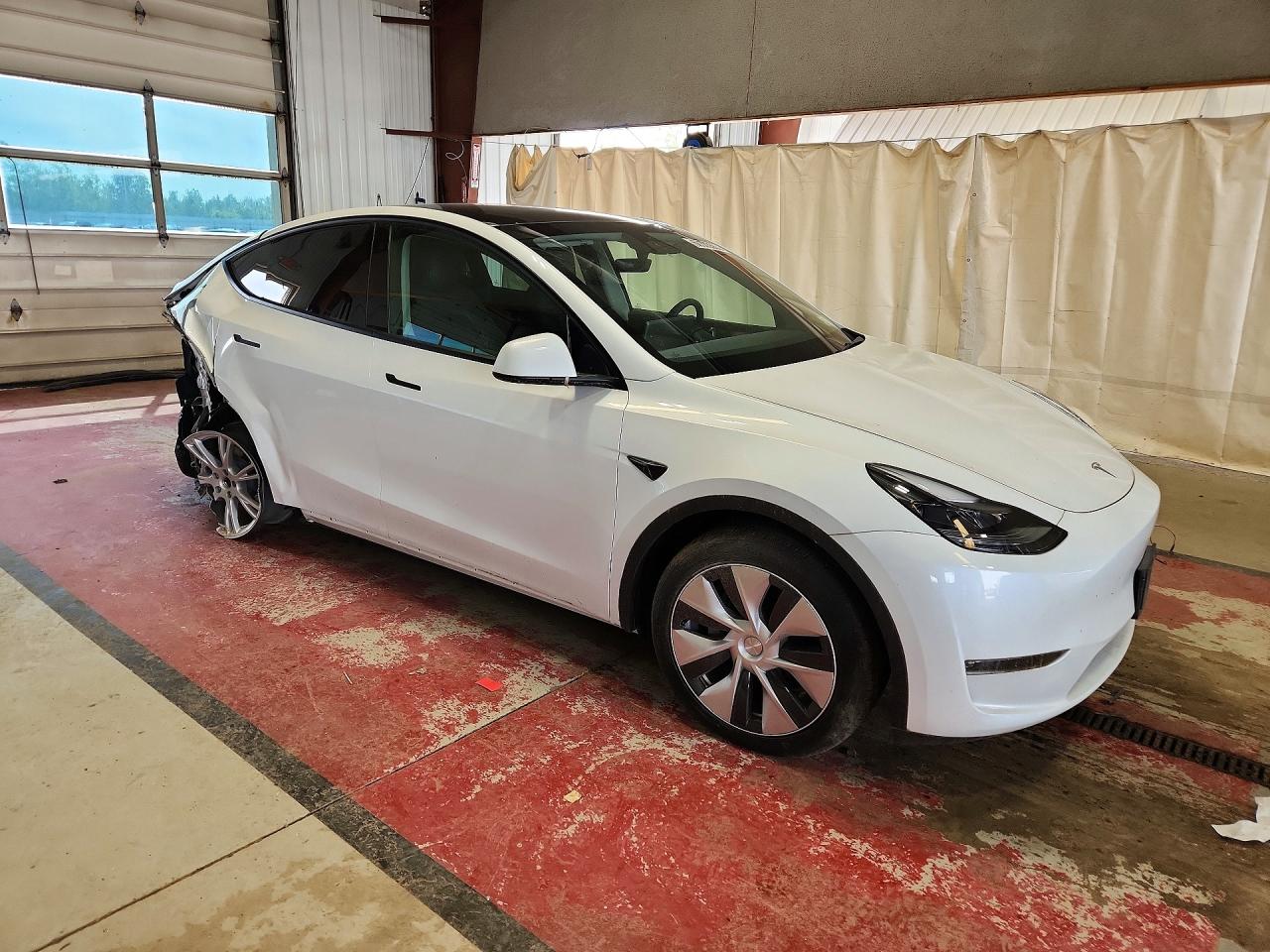 2023 Tesla Model Y VIN 7SAYGDEE7PF606971 COPART salvage auction — Rear End, NY - MV-907A SALVAGE CERTIFICATE, sold $8,900 on 2026-07-06 (photo 4)