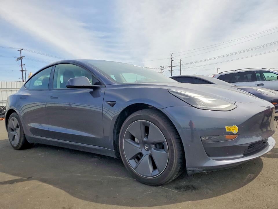 2022 Tesla Model 3 VIN 5YJ3E1EBXNF323012 COPART salvage auction — REAR END, Ca - Salvage Certificate, sold $8,700 on 2026-07-13 (photo 4)