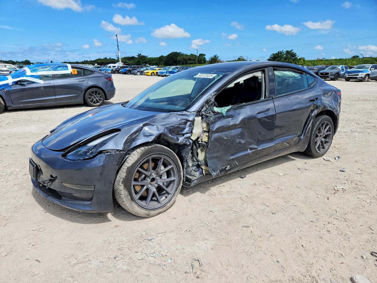 2023 Tesla Model 3 VIN 5YJ3E1EA7PF697474 COPART salvage auction — Side, MD - CERTIFICATE OF TITLE, sold $5,900 on 2026-07-03 (photo 1)
