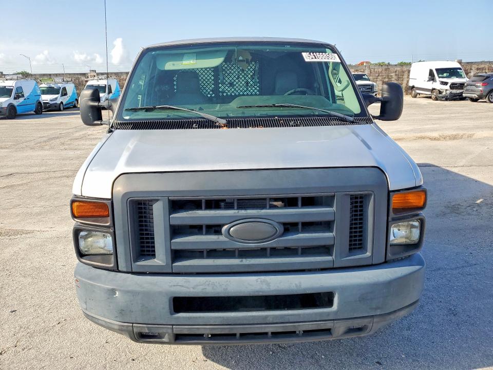 2014 Ford VIN 1FTNE1EW8EDB05699 COPART salvage auction — MINOR DENT/SCRATCHES, Fl - Certificate Of Title, sold $1,000 on 2026-07-09 (photo 5)