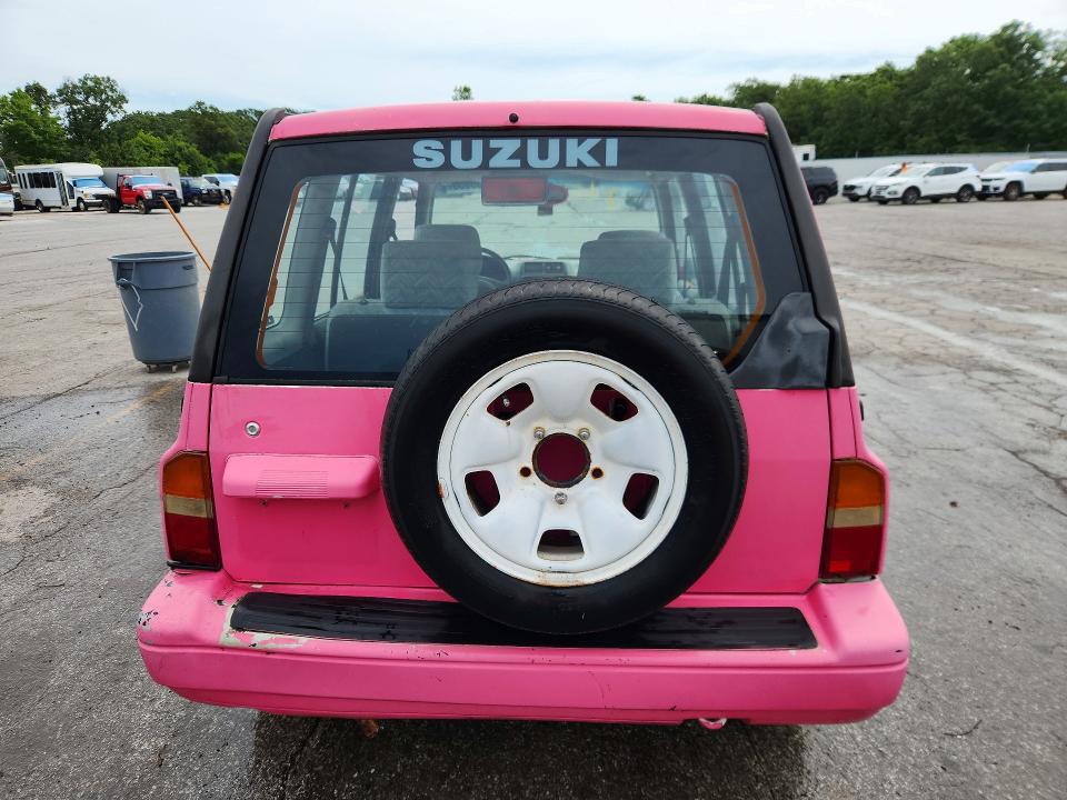 1998 Suzuki Sidekick VIN JS3TD21V3W4109675 COPART salvage auction — HAIL, Mo - Salvage Certificate Of Title, sold $300 on 2026-07-20 (photo 6)