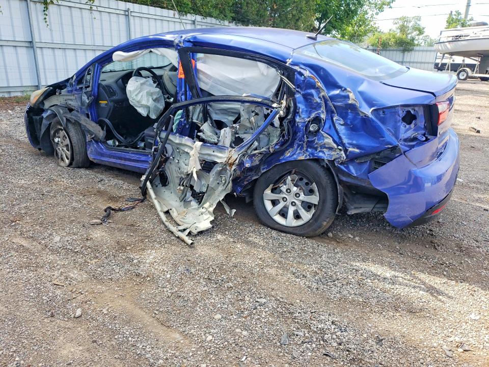 2014 Kia Rio VIN KNADM4A31E6368615 COPART salvage auction — SIDE, On - Permit Irrepairable, sold $425 on 2026-07-09 (photo 2)