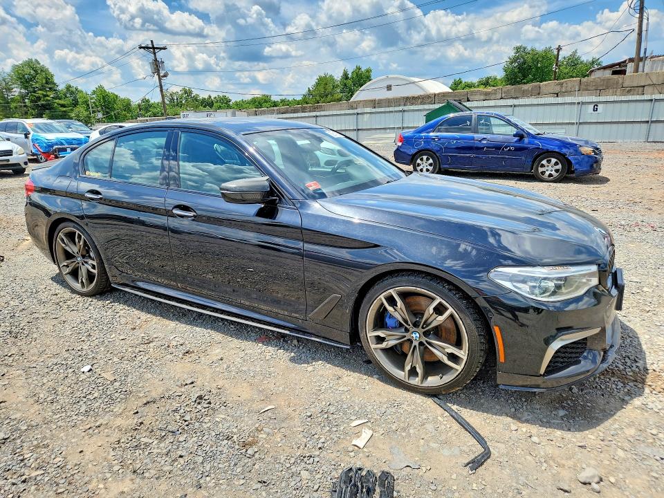2018 BMW M550i xdrive VIN WBAJB9C58JB035348 COPART salvage auction — SIDE, RI - CERTIFICATE OF TITLE, sold $11,500 on 2026-07-16 (photo 4)