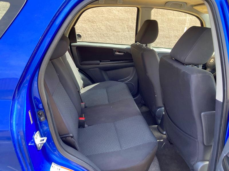 2013 Suzuki Sx4 VIN JS2YB5A31D6101902 COPART salvage auction — DAMAGE HISTORY, Co - Dlr/Dis/Exp-Ct Others-Ca Acq (P), sold $450 on 2026-07-09 (photo 6)