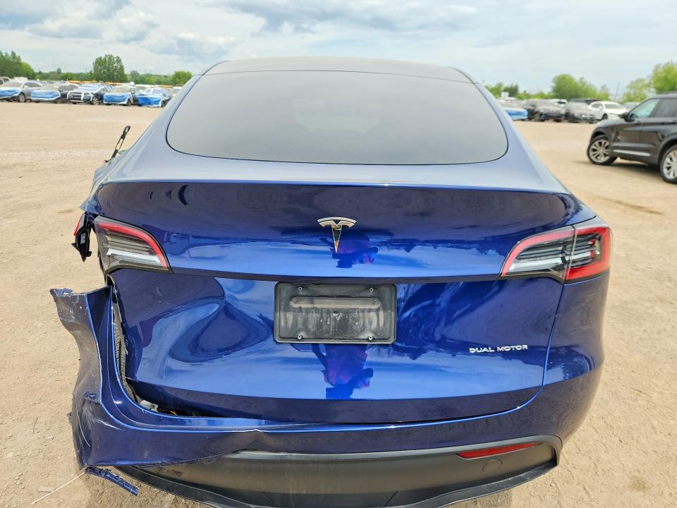 2023 Tesla Model y VIN LRWYGDEE0PC228256 COPART salvage auction — REAR END, ON - PERMIT SALVAGE, sold $10,700 on 2026-07-30 (photo 6)
