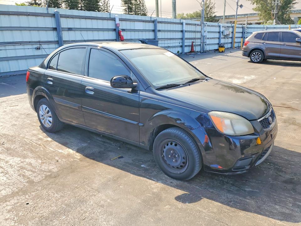 2010 Kia Rio VIN KNADH4A38A6635781 COPART salvage auction — SIDE, Fl - Cert Of Title Slvg Rebuildable, sold $425 on 2026-07-11 (photo 4)